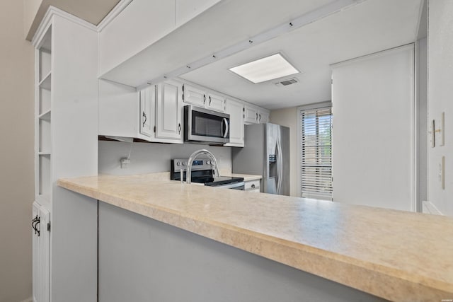 12 Beldoir Ct Unit 12, Hot Springs, AR 71901 - kitchen featuring stainless steel appliances, light countertops, and white cabinets