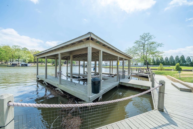 dock area featuring a water view and boat lift