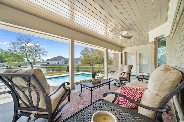 sunroom / solarium with a healthy amount of sunlight, french doors, and wood ceiling