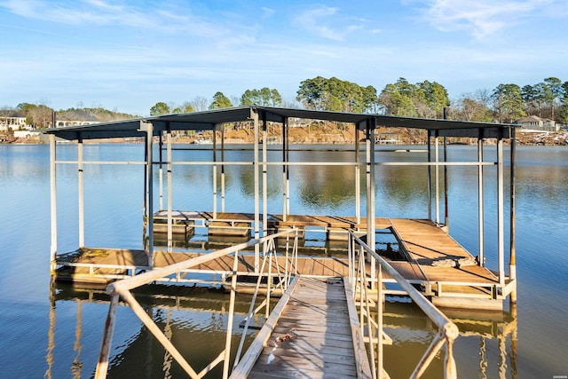 view of dock with a water view and boat lift