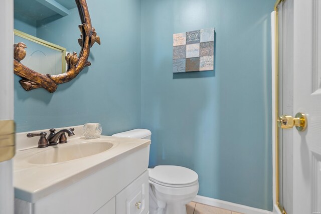 bathroom featuring vanity, toilet, and tile patterned floors