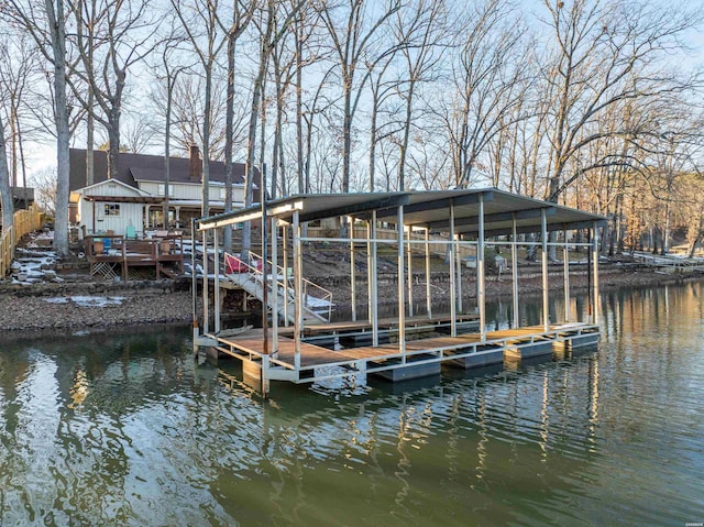 dock area featuring a deck with water view