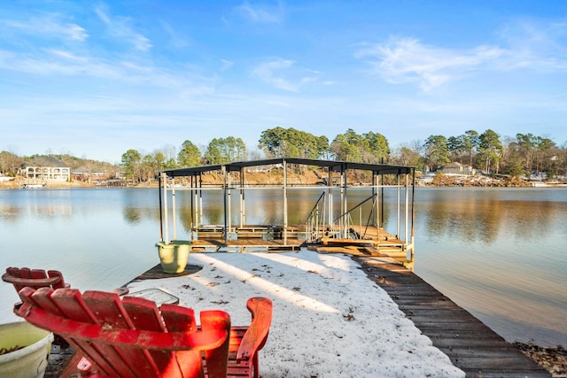 dock area with a water view and boat lift