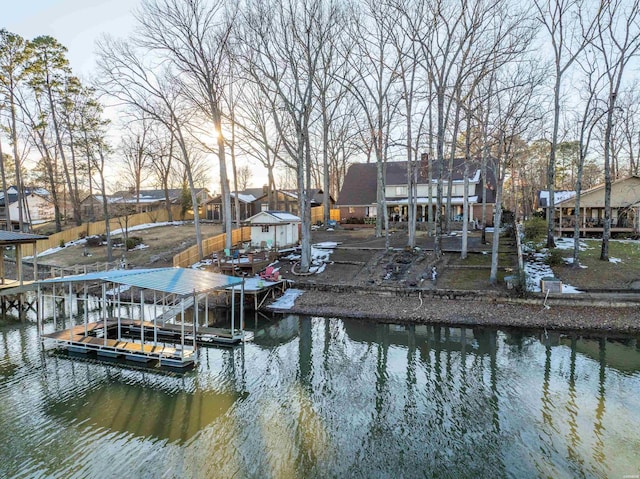 dock area with a residential view and a water view