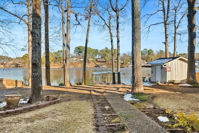 exterior space with a water view and an outdoor structure