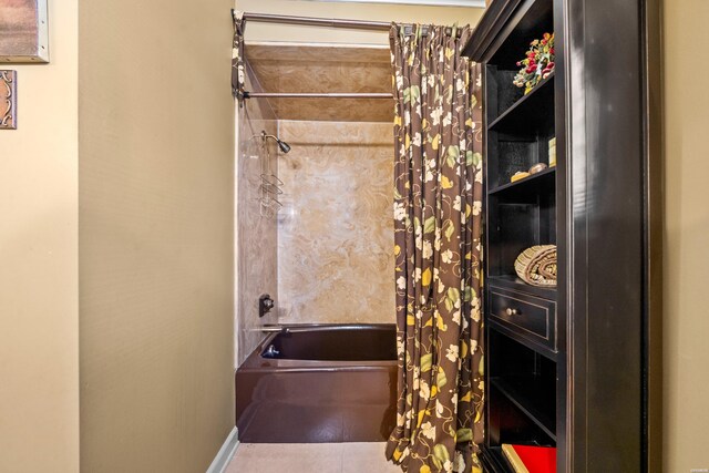 bathroom featuring shower / bath combo and tile patterned floors