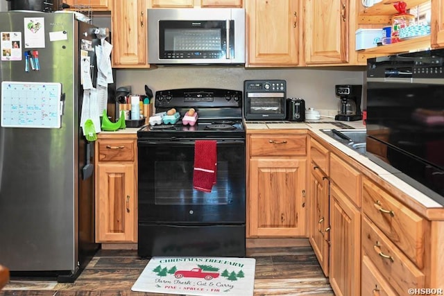 142 Taylor Loop, Oden, AR 71961 - kitchen featuring stainless steel appliances, dark wood-style floors, and tile countertops
