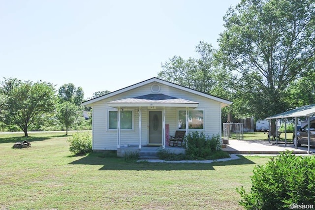 142 Taylor Loop, Oden, AR 71961 - bungalow-style house with covered porch and a front yard