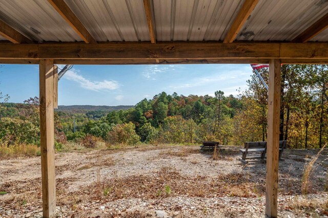 view of yard featuring a view of trees