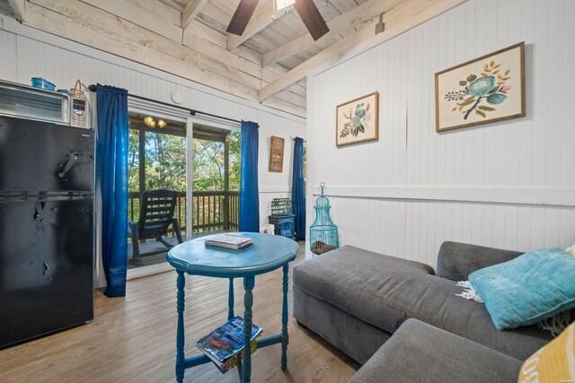 living area featuring wood ceiling, beam ceiling, ceiling fan, and wood finished floors