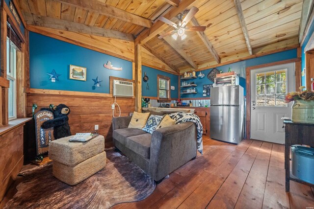 living area featuring wainscoting, lofted ceiling with beams, a wall unit AC, wood ceiling, and wood finished floors