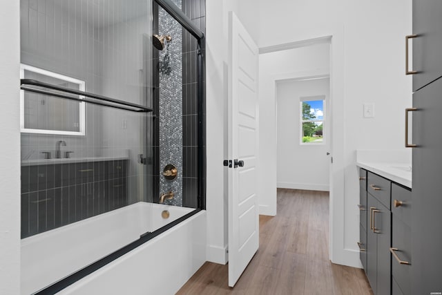 168 Krause Ln Unit A & B, Hot Springs, AR 71913 - full bath featuring vanity, wood finished floors, baseboards, and enclosed tub / shower combo