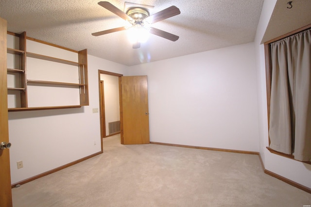 1 Alora Ln, Hot Springs Village, AR 71909 - unfurnished bedroom with ceiling fan, a textured ceiling, light carpet, visible vents, and baseboards