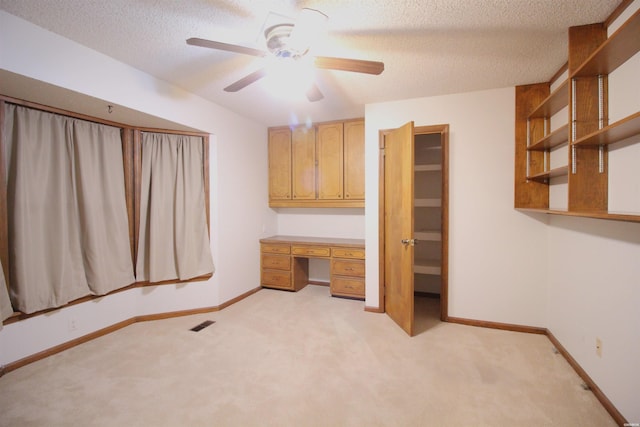1 Alora Ln, Hot Springs Village, AR 71909 - interior space with a textured ceiling, light carpet, built in study area, and baseboards
