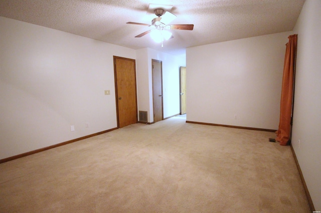 1 Alora Ln, Hot Springs Village, AR 71909 - spare room featuring baseboards, a textured ceiling, and light colored carpet
