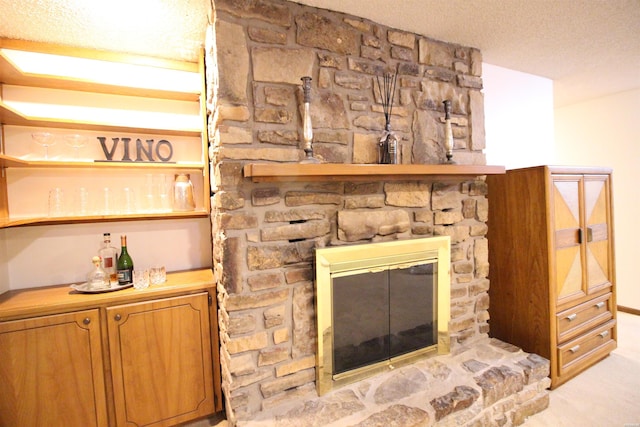 1 Alora Ln, Hot Springs Village, AR 71909 - details featuring a textured ceiling, a stone fireplace, and carpet