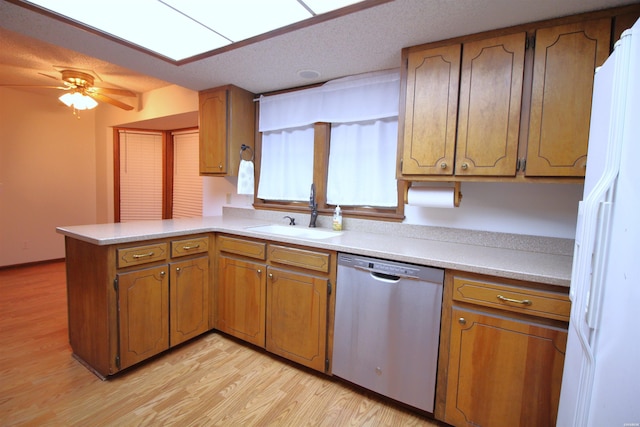 1 Alora Ln, Hot Springs Village, AR 71909 - kitchen with dishwasher, brown cabinets, a peninsula, light countertops, and a sink