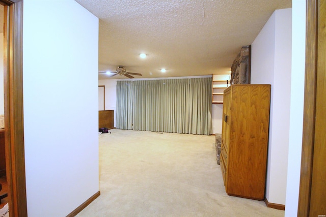 1 Alora Ln, Hot Springs Village, AR 71909 - corridor featuring light carpet, a textured ceiling, and baseboards