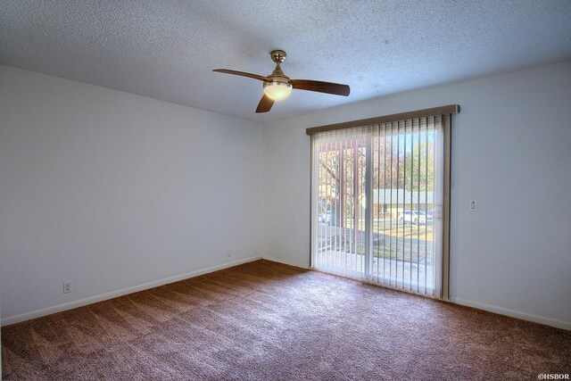 carpeted spare room featuring ceiling fan, baseboards, and a textured ceiling