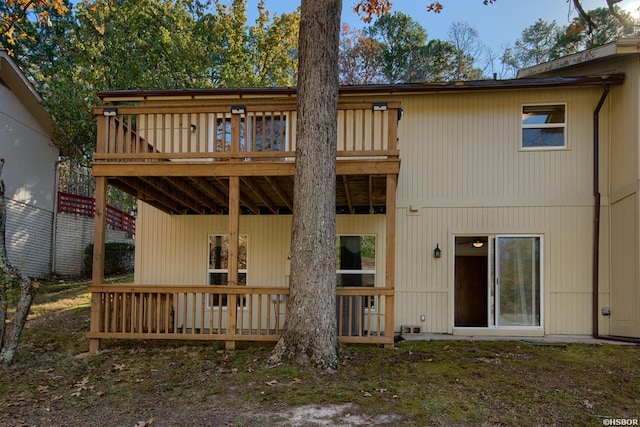 rear view of property featuring a deck