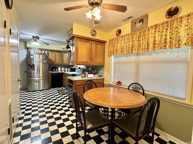 dining area featuring light floors, baseboards, visible vents, and ceiling fan