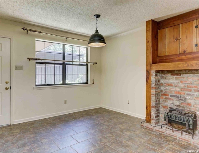 unfurnished living room with a textured ceiling and baseboards