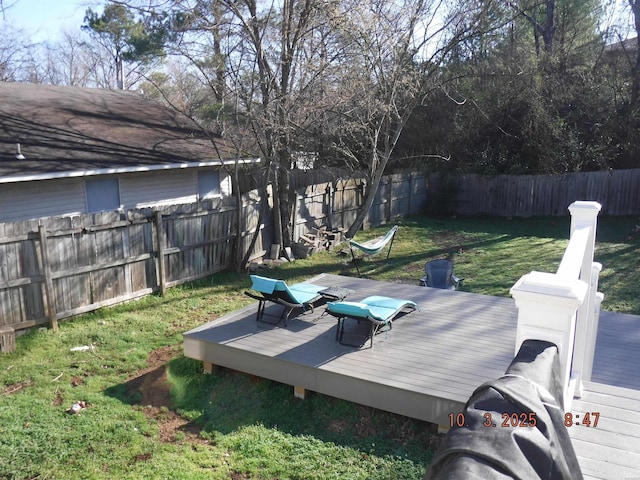 view of yard featuring a fenced backyard and a deck