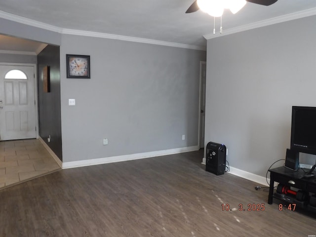 unfurnished living room with ceiling fan, baseboards, wood finished floors, and ornamental molding