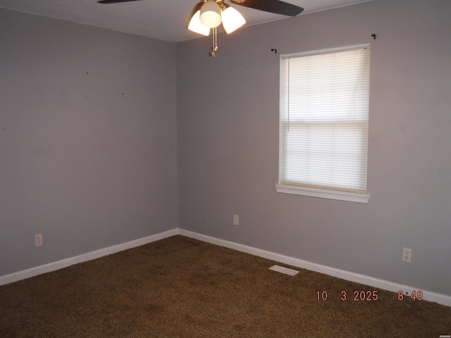 empty room with a ceiling fan, baseboards, and carpet floors