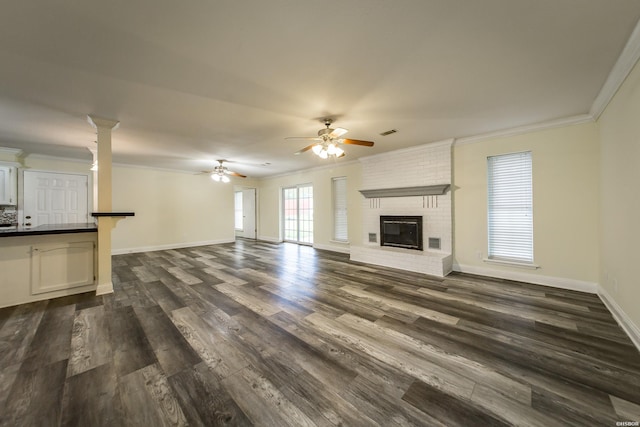 221 San Juan Dr, Hot Springs, AR 71913 - unfurnished living room featuring ornamental molding, dark wood finished floors, ceiling fan, and a fireplace