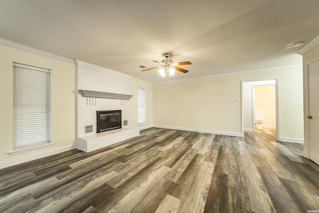 221 San Juan Dr, Hot Springs, AR 71913 - unfurnished living room with a ceiling fan, crown molding, wood finished floors, and a brick fireplace