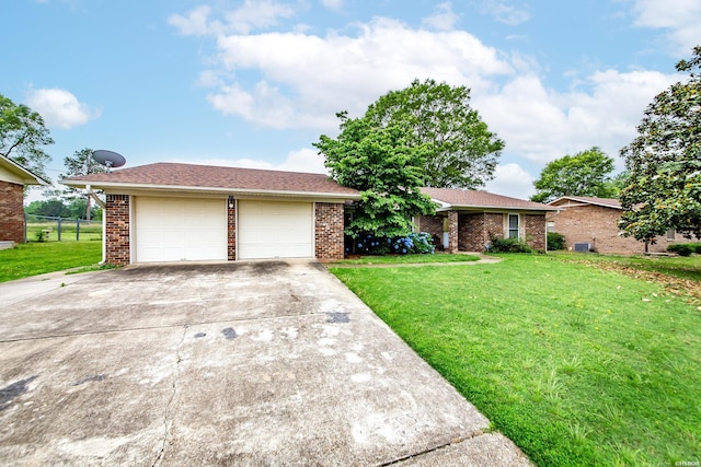221 San Juan Dr, Hot Springs, AR 71913 - view of front of property with a front lawn, brick siding, driveway, and an attached garage