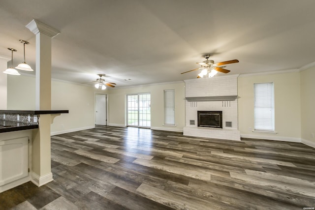 221 San Juan Dr, Hot Springs, AR 71913 - unfurnished living room featuring ceiling fan, ornamental molding, dark wood-style flooring, and a fireplace