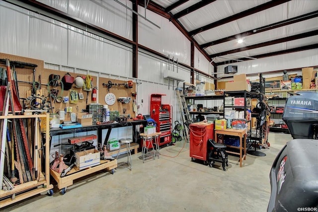 garage with metal wall and a workshop area