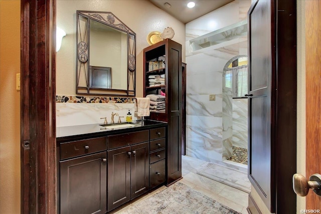 bathroom with tile patterned floors, vanity, and a stall shower