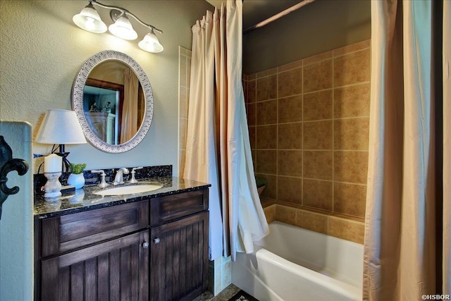 full bath with vanity and shower / bath combo with shower curtain