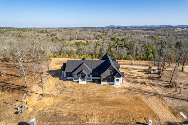 birds eye view of property with a rural view