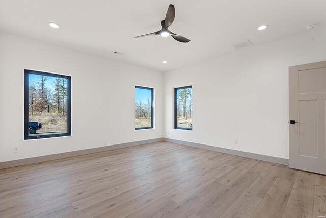 unfurnished room featuring visible vents, baseboards, light wood-style flooring, ceiling fan, and recessed lighting