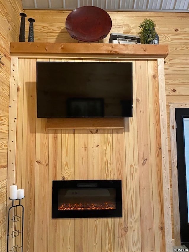 details with a glass covered fireplace