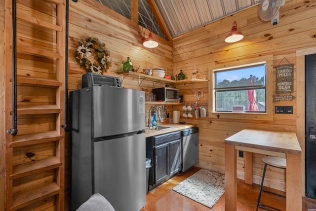 1136 Arlie Moore Rd, Bismarck, AR 71929 - kitchen with wooden walls, open shelves, a sink, vaulted ceiling, and appliances with stainless steel finishes