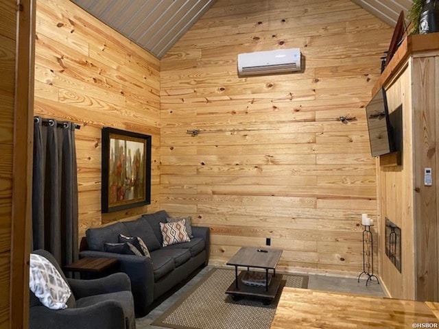 living area with a wall mounted air conditioner, lofted ceiling, and wood walls