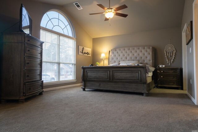 carpeted bedroom featuring baseboards, multiple windows, high vaulted ceiling, and visible vents