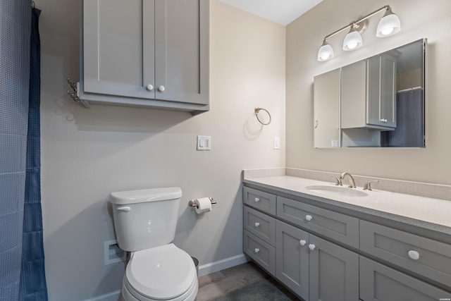 18 Escondite Ln, Hot Springs Village, AR 71909 - bathroom with toilet, baseboards, and vanity