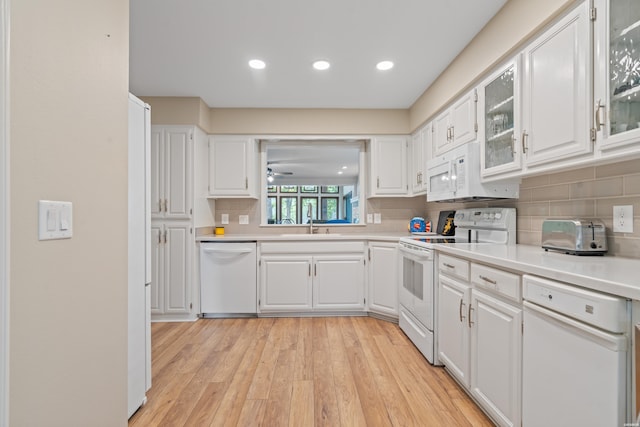18 Escondite Ln, Hot Springs Village, AR 71909 - kitchen with white appliances, light countertops, backsplash, white cabinetry, and recessed lighting