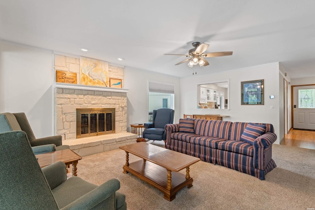 18 Escondite Ln, Hot Springs Village, AR 71909 - carpeted living room featuring a ceiling fan, a stone fireplace, and recessed lighting