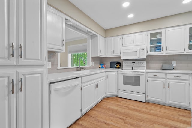18 Escondite Ln, Hot Springs Village, AR 71909 - kitchen with white appliances, a sink, light countertops, white cabinets, and recessed lighting