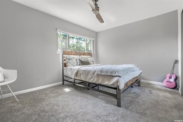 carpeted bedroom featuring a ceiling fan and baseboards