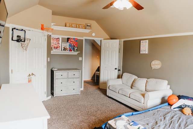 living room featuring a ceiling fan, vaulted ceiling, and carpet flooring