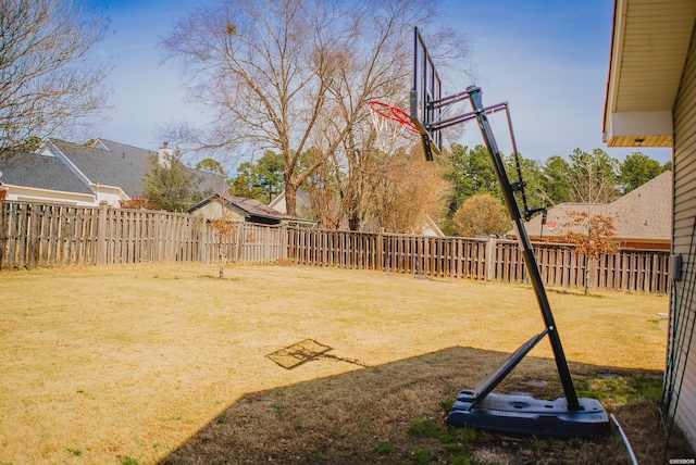 view of yard with a fenced backyard