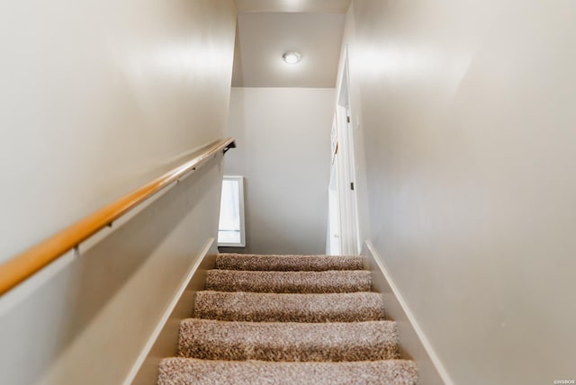 stairs featuring baseboards